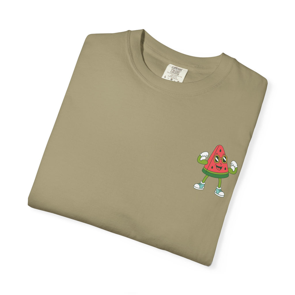 Folded khaki t-shirt with a small Mel the Melon flexing graphic on a white background