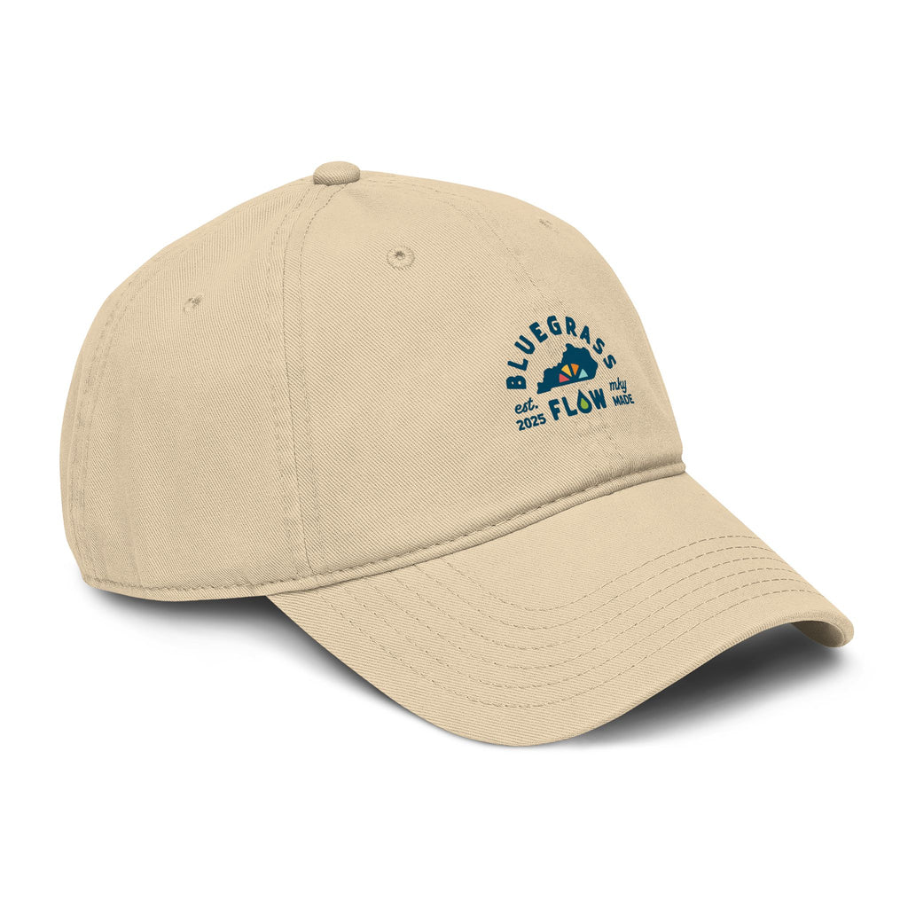 Beige cap with bluegrass flow logo on a white background