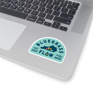 Laptop with a 'Bluegrass Flow' sticker on the palm rest area